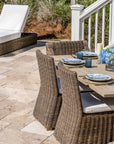 Outdoor Grey Teak Trestle Dining Table with wicker chairs